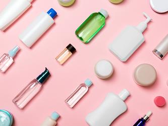 bottles and other product containers of varying sizes, all blank, without labels